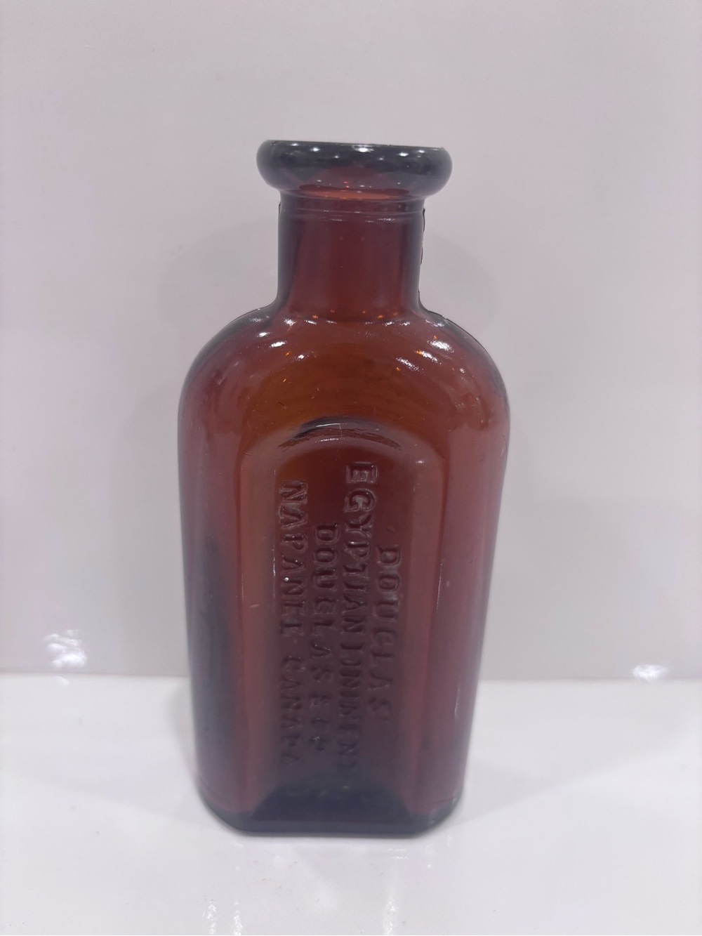 Vintage Douglas’ Egyptian Liniment Amber embossed medicine bottle Napanee Canada